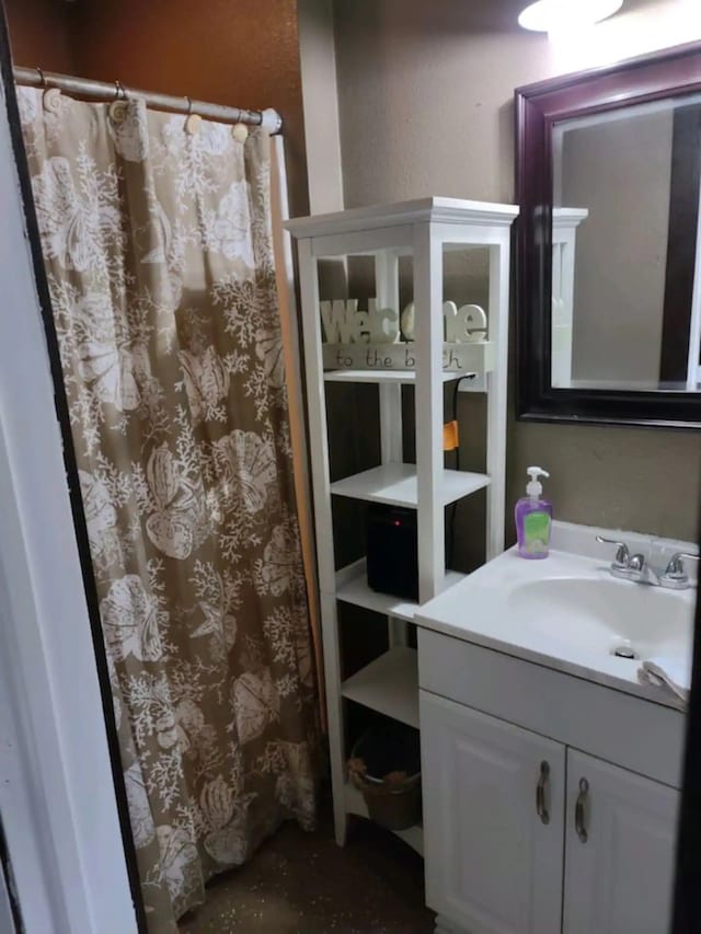 23002 Vida, Galveston, TX 77554 - full bathroom featuring vanity and curtained shower