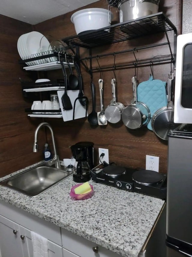 23002 Vida, Galveston, TX 77554 - kitchen view of a sink and light stone countertops