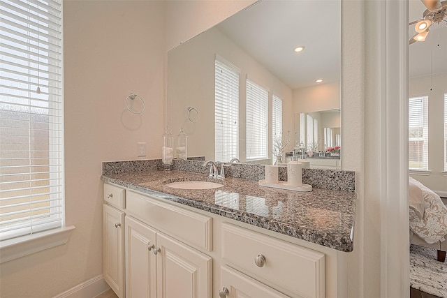 47 Monarch Trl, Sugar Land, TX 77498 - bathroom with vanity, plenty of natural light, connected bathroom, ceiling fan, and recessed lighting