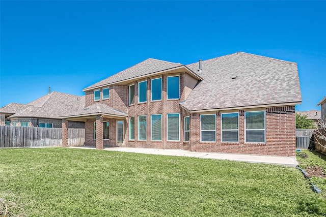 47 Monarch Trl, Sugar Land, TX 77498 - rear view of property with roof with shingles, brick siding, a patio area, and a fenced backyard
