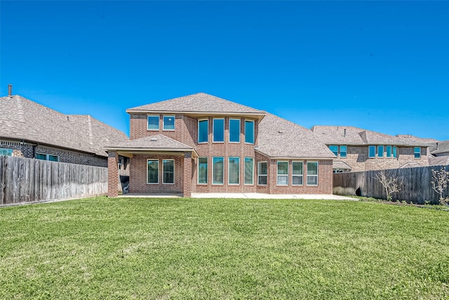 47 Monarch Trl, Sugar Land, TX 77498 - back of house featuring a patio area, brick siding, a fenced backyard, and roof with shingles