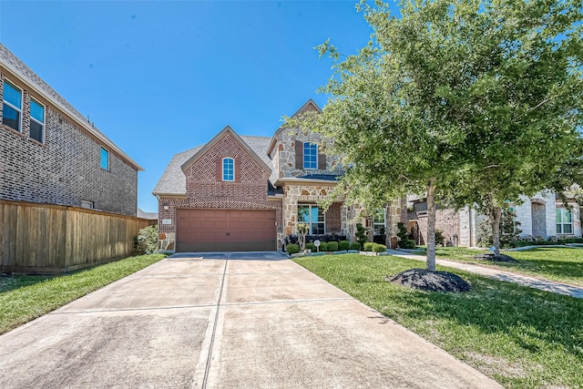 47 Monarch Trl, Sugar Land, TX 77498 - view of front of house with brick siding, driveway, a garage, and stone siding