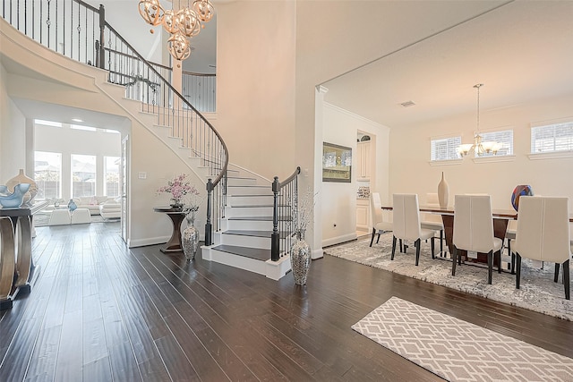 47 Monarch Trl, Sugar Land, TX 77498 - foyer entrance featuring a chandelier, stairs, and wood-type flooring