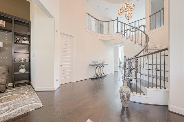 47 Monarch Trl, Sugar Land, TX 77498 - foyer with wood finished floors, a chandelier, stairway, and a high ceiling