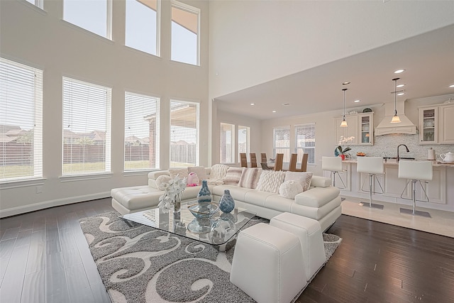 47 Monarch Trl, Sugar Land, TX 77498 - living area with dark wood-style floors, recessed lighting, and a towering ceiling