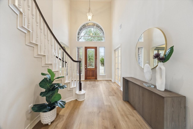 12410 Sonata Canyon Ln, Houston, TX 77041 - foyer entrance featuring light wood-type flooring, stairway, and a high ceiling