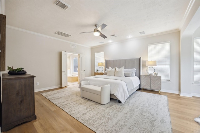 12410 Sonata Canyon Ln, Houston, TX 77041 - bedroom with light wood-type flooring, ornamental molding, a textured ceiling, a ceiling fan, and ensuite bath