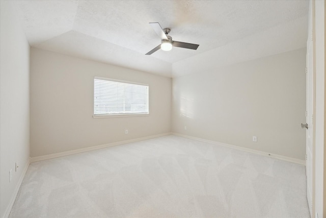12410 Sonata Canyon Ln, Houston, TX 77041 - spare room with light colored carpet, a ceiling fan, vaulted ceiling, and a textured ceiling
