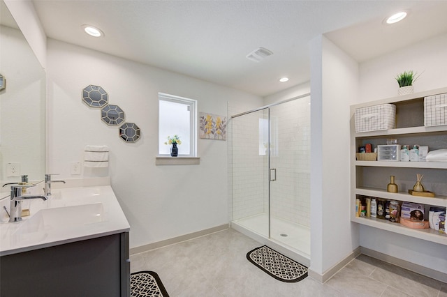 29918 Reagans Ranch Dr, Katy, TX 77494 - bathroom featuring double vanity, a shower stall, recessed lighting, and tile patterned floors