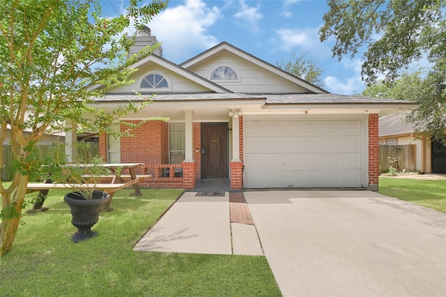 15811 Beechnut St, Houston, TX 77083 - view of front of property featuring brick siding, driveway, an attached garage, and covered porch