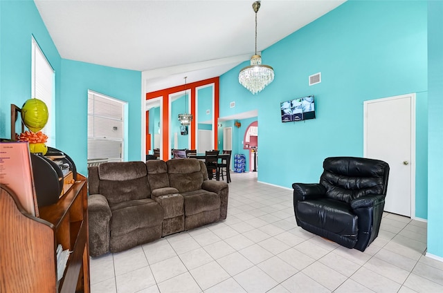 15811 Beechnut St, Houston, TX 77083 - living room with a chandelier, high vaulted ceiling, and light tile patterned flooring