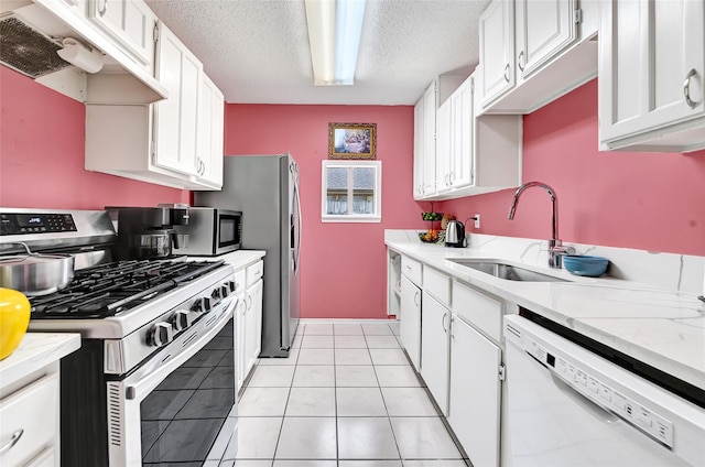 15811 Beechnut St, Houston, TX 77083 - kitchen with stainless steel range with gas stovetop, white dishwasher, premium range hood, light countertops, and a textured ceiling
