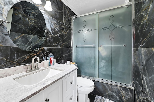 15811 Beechnut St, Houston, TX 77083 - full bathroom featuring vanity, tile walls, a shower with door, and decorative backsplash