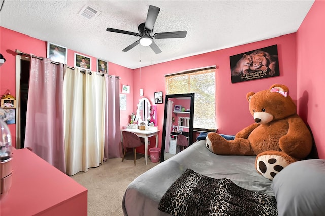 15811 Beechnut St, Houston, TX 77083 - carpeted bedroom with a textured ceiling and ceiling fan