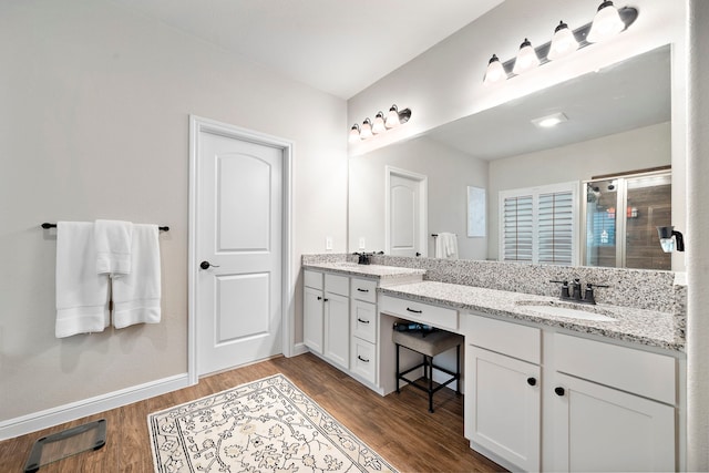 2707 Wollemi Pine Trl, Katy, TX 77493 - bathroom featuring double vanity, wood finished floors, and a shower stall
