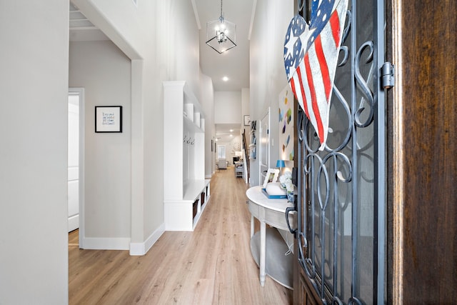 2707 Wollemi Pine Trl, Katy, TX 77493 - foyer entrance featuring light wood-type flooring, a towering ceiling, and a chandelier