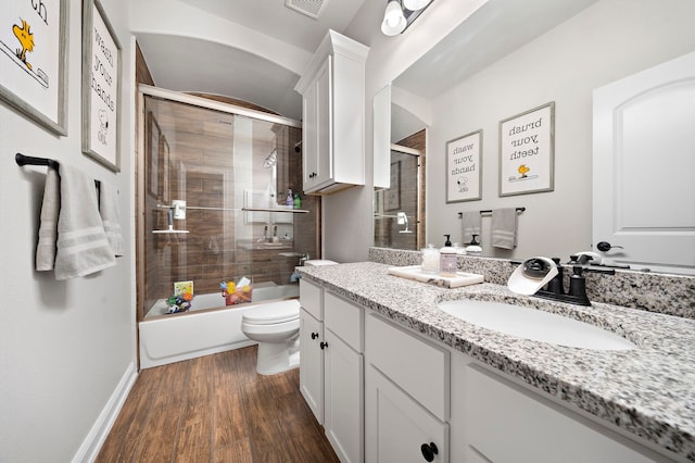 2707 Wollemi Pine Trl, Katy, TX 77493 - full bathroom with vanity, wood finished floors, and combined bath / shower with glass door