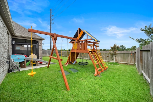 2707 Wollemi Pine Trl, Katy, TX 77493 - view of playground with a fenced backyard and a sunroom