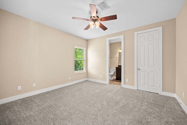 1161 Beasley Hills Ln, Houston, TX 77008 - unfurnished bedroom with light carpet, connected bathroom, and a ceiling fan