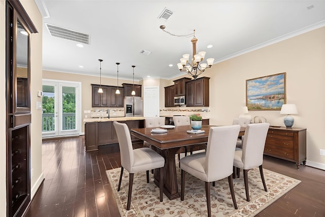1161 Beasley Hills Ln, Houston, TX 77008 - dining area with a chandelier, dark wood-style flooring, recessed lighting, and crown molding