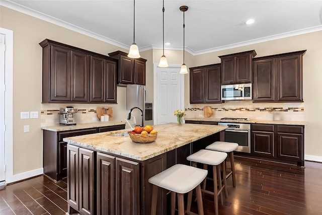 1161 Beasley Hills Ln, Houston, TX 77008 - kitchen featuring appliances with stainless steel finishes, dark brown cabinetry, dark wood-style floors, backsplash, and recessed lighting