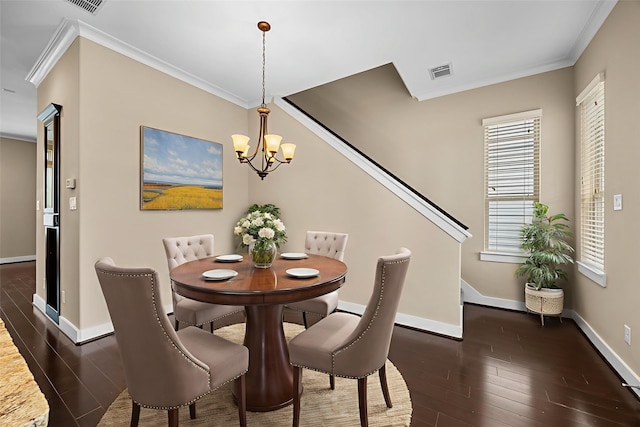 1161 Beasley Hills Ln, Houston, TX 77008 - dining area with a chandelier, crown molding, and dark wood finished floors