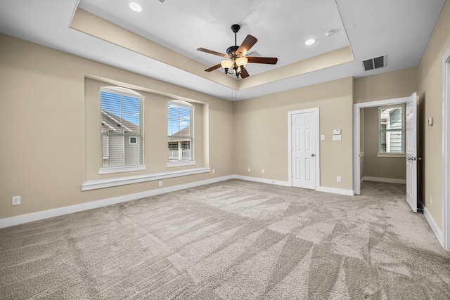 1161 Beasley Hills Ln, Houston, TX 77008 - unfurnished bedroom with a tray ceiling, carpet floors, recessed lighting, and a ceiling fan
