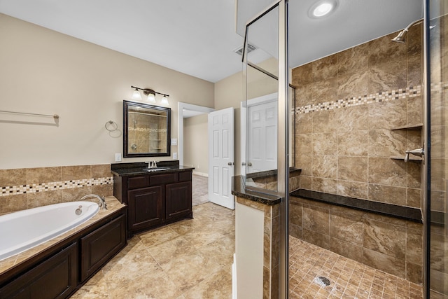 1161 Beasley Hills Ln, Houston, TX 77008 - full bath featuring a stall shower, a garden tub, and vanity