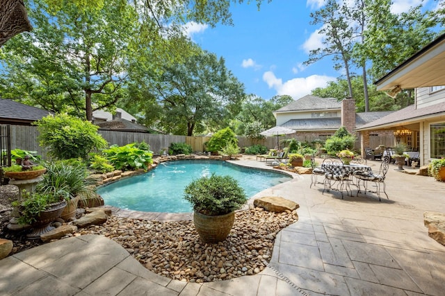 5610 Edgewick Ct, Houston, TX 77069 - view of swimming pool featuring a patio, a fenced backyard, and outdoor dining space