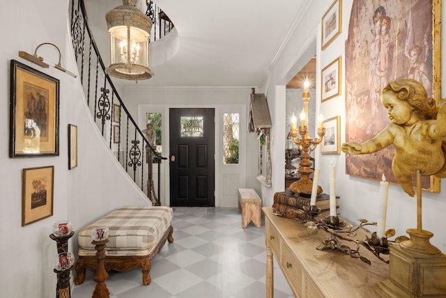 5610 Edgewick Ct, Houston, TX 77069 - entrance foyer featuring tile patterned floors, stairs, crown molding, and a chandelier