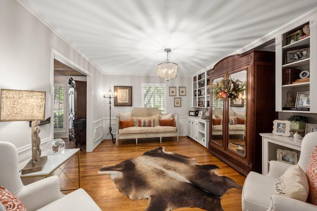 5610 Edgewick Ct, Houston, TX 77069 - living room featuring a chandelier, plenty of natural light, crown molding, and wood finished floors