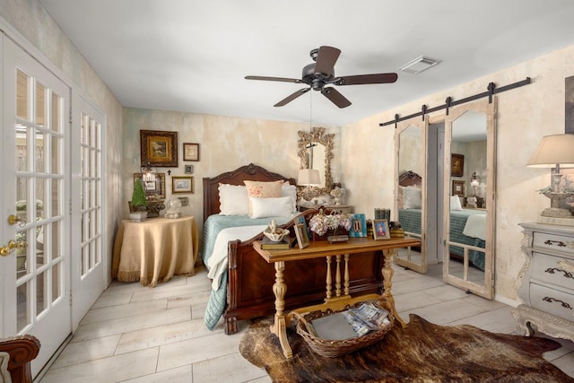 5610 Edgewick Ct, Houston, TX 77069 - bedroom with a barn door, ceiling fan, and wood finished floors