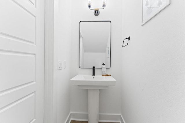 8302 Springwood Canyon Ln, Houston, TX 77055 - bathroom with baseboards and wood finished floors