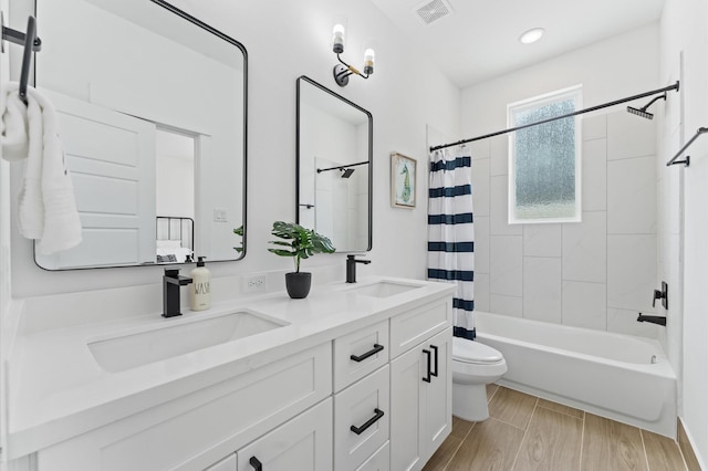 8302 Springwood Canyon Ln, Houston, TX 77055 - bathroom featuring double vanity, shower / tub combo, and recessed lighting