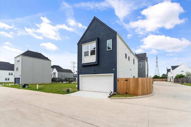 8302 Springwood Canyon Ln, Houston, TX 77055 - view of side of home featuring driveway and an attached garage