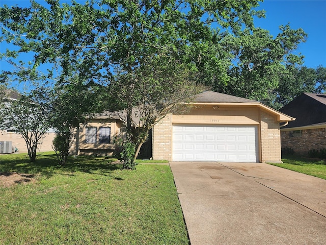 15006 Yorktown Colony Dr, Houston, TX 77084 - view of front of home with driveway, a front lawn, brick siding, and an attached garage