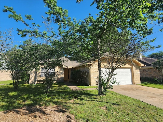 15006 Yorktown Colony Dr, Houston, TX 77084 - view of property hidden behind natural elements with a garage, concrete driveway, brick siding, and a front lawn