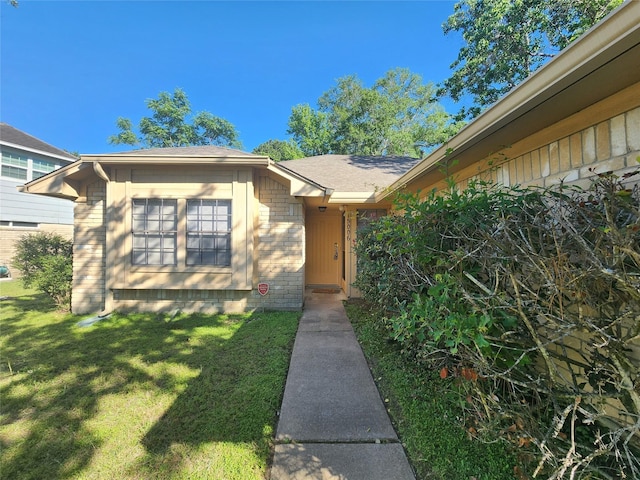 15006 Yorktown Colony Dr, Houston, TX 77084 - view of exterior entry with a lawn