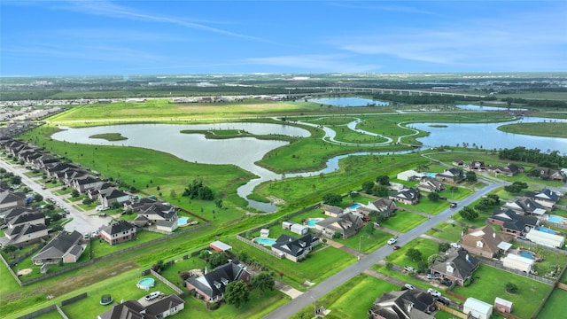 9826 Palm Dr, Mont Belvieu, TX 77523 - aerial view of property and surrounding area featuring a large body of water and nearby suburban area