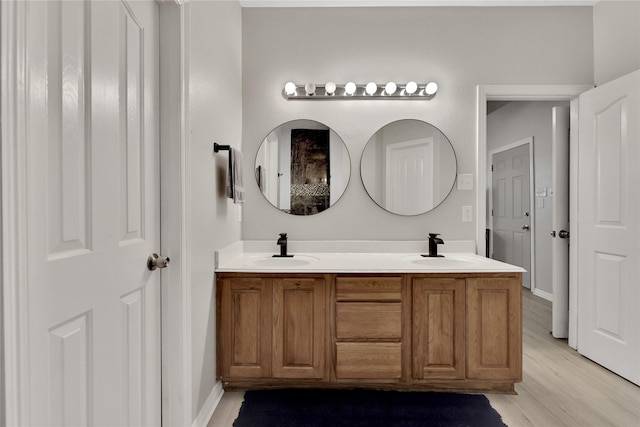 9826 Palm Dr, Mont Belvieu, TX 77523 - full bath with double vanity and wood finished floors