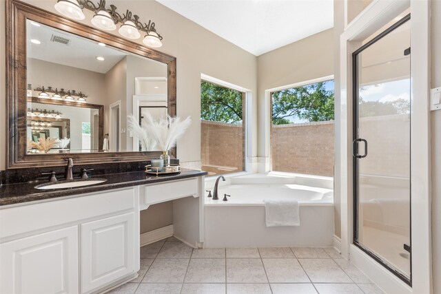 904 Pine Hollow Dr, Friendswood, TX 77546 - bathroom with vanity, a garden tub, a shower stall, and tile patterned floors