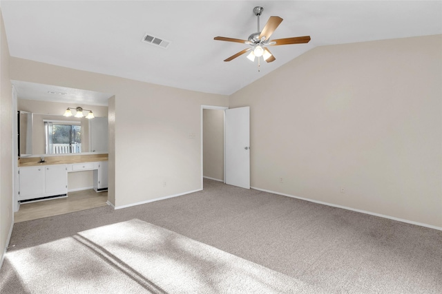 14911 Wunderlich Dr Unit 613, Houston, TX 77069 - unfurnished bedroom with vaulted ceiling, light carpet, ensuite bath, and a ceiling fan