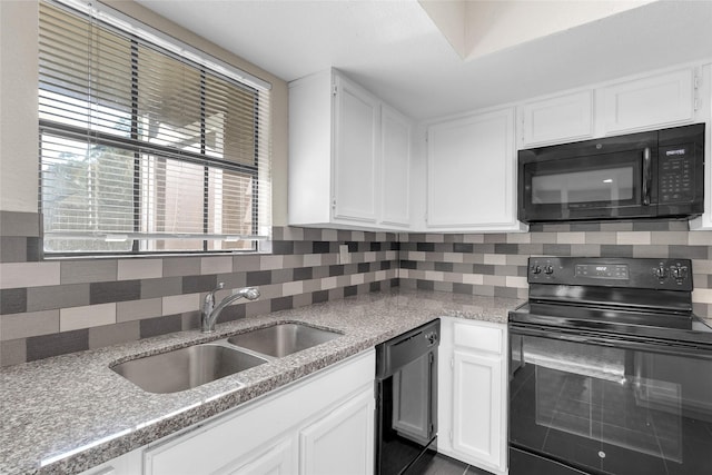 14911 Wunderlich Dr Unit 613, Houston, TX 77069 - kitchen with black appliances, white cabinetry, and decorative backsplash