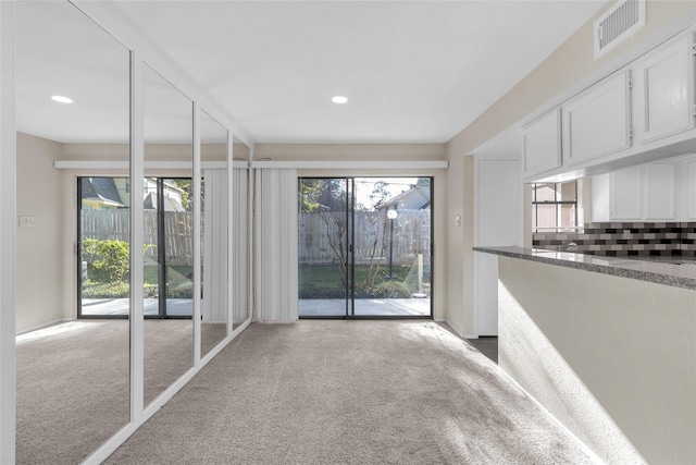 14911 Wunderlich Dr Unit 613, Houston, TX 77069 - carpeted empty room with plenty of natural light and recessed lighting