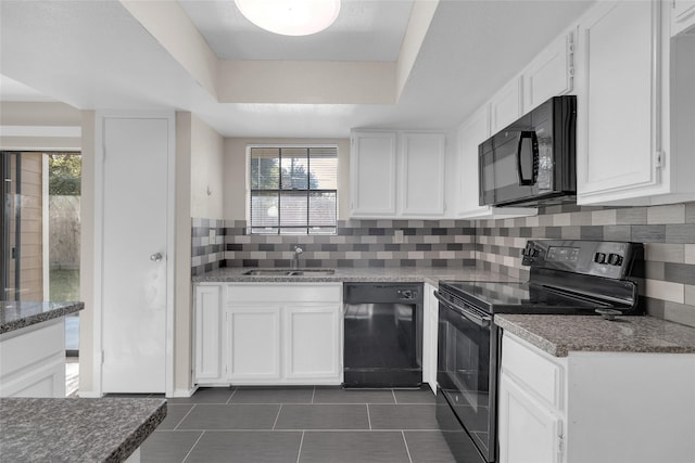 14911 Wunderlich Dr Unit 613, Houston, TX 77069 - kitchen featuring black appliances, white cabinets, dark tile patterned floors, and healthy amount of natural light