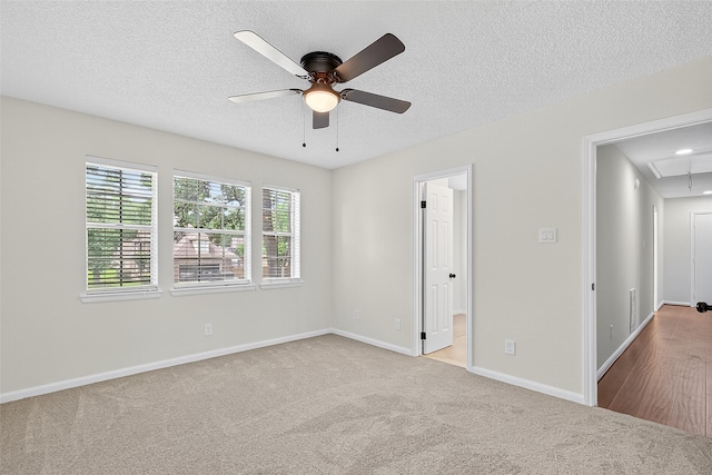 19502 Enchanted Oaks Dr, Spring, TX 77388 - unfurnished bedroom featuring attic access, carpet floors, a textured ceiling, and ceiling fan