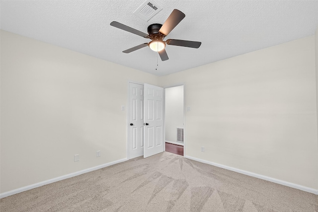 19502 Enchanted Oaks Dr, Spring, TX 77388 - unfurnished bedroom featuring carpet flooring, a textured ceiling, and ceiling fan