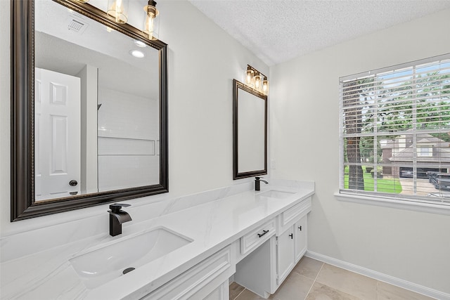 19502 Enchanted Oaks Dr, Spring, TX 77388 - bathroom with double vanity and a textured ceiling