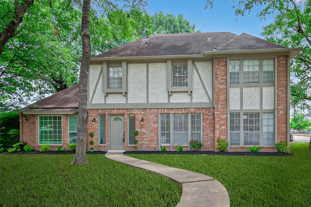 19502 Enchanted Oaks Dr, Spring, TX 77388 - english style home with stucco siding, roof with shingles, and a front yard