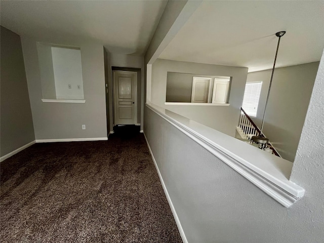 8303 Gros Ventre Ln, Houston, TX 77095 - hall featuring dark carpet and an upstairs landing